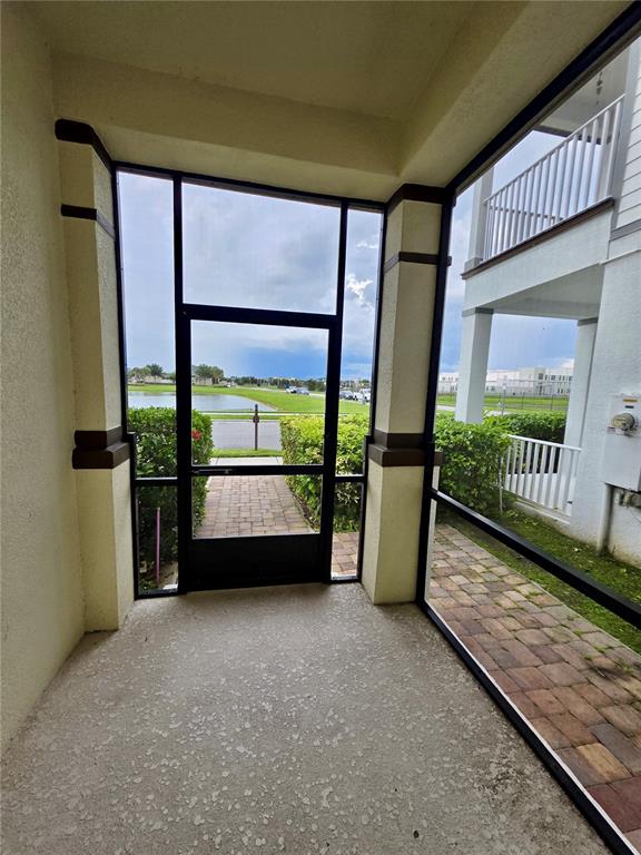 8582 Powder Ridge Trail Windermere, FL 34786 - Photo 2 of 50 a view of a porch with furniture and floor to ceiling window