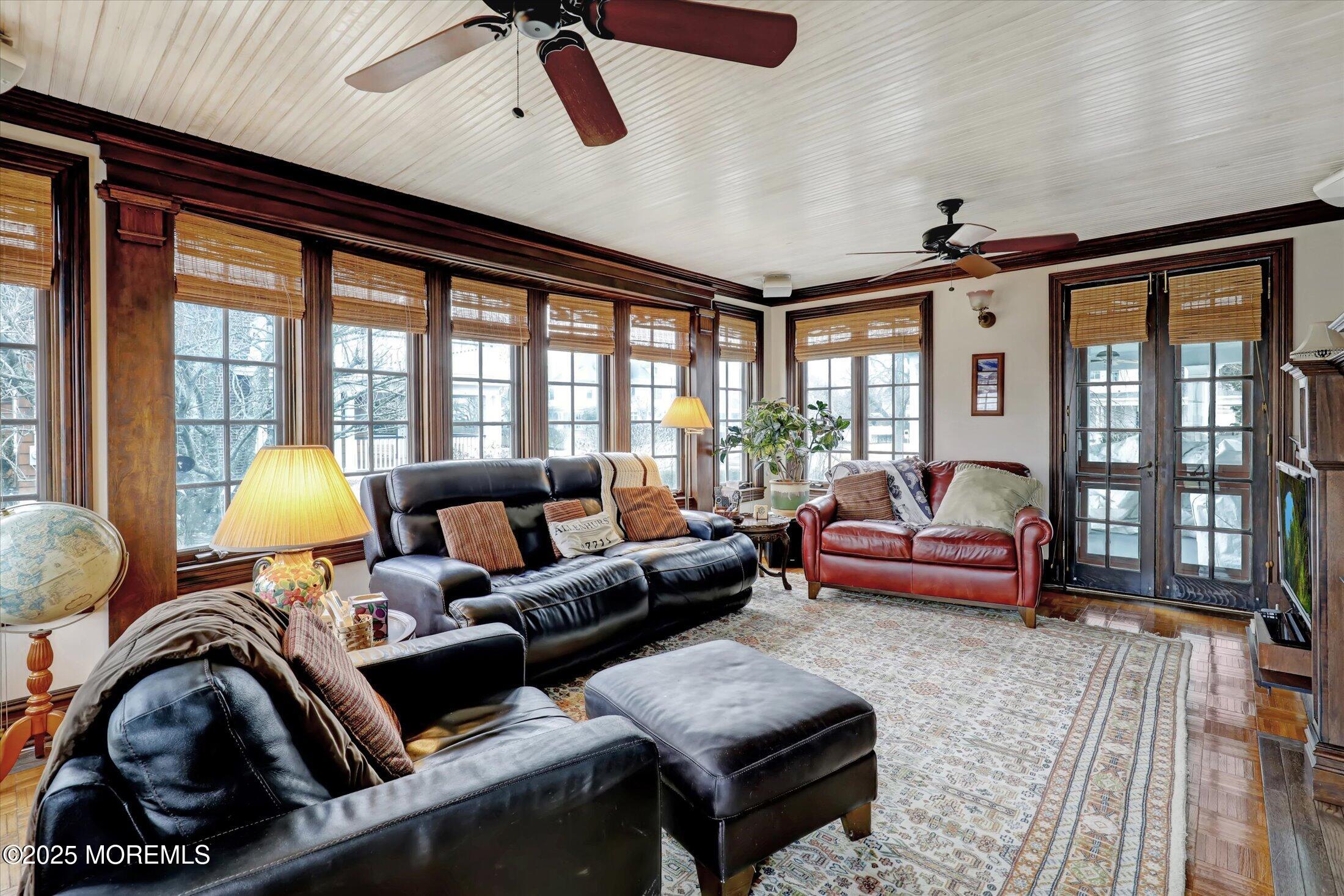 211 Cedar Avenue Allenhurst, NJ 07711 - Photo 13 of 69 a living room with furniture and a floor to ceiling window