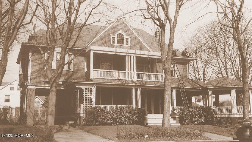 211 Cedar Avenue Allenhurst, NJ 07711 - Photo 2 of 69 a front view of a house with a yard