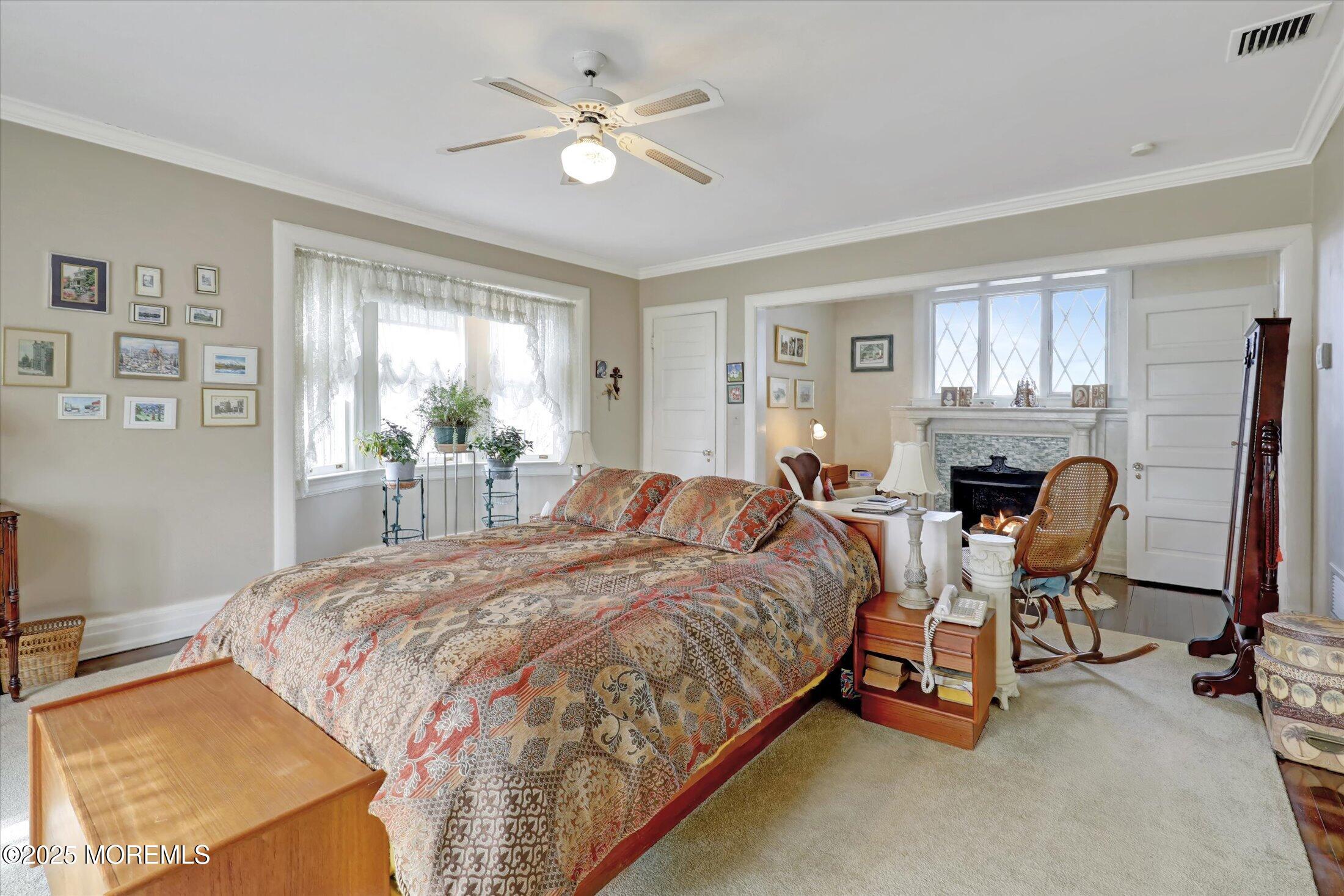 211 Cedar Avenue Allenhurst, NJ 07711 - Photo 25 of 69 a bedroom with a bed chairs and a window