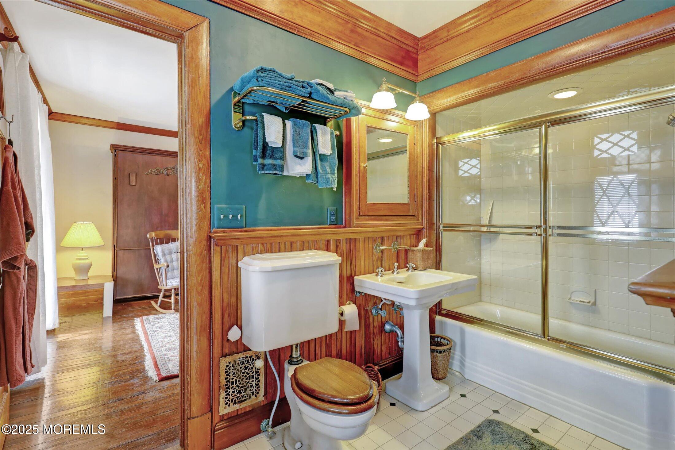 211 Cedar Avenue Allenhurst, NJ 07711 - Photo 30 of 69 a bathroom with a sink a toilet and shower