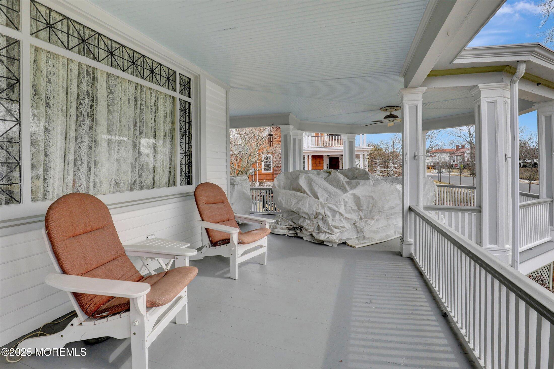 211 Cedar Avenue Allenhurst, NJ 07711 - Photo 3 of 69 a living room with furniture and a floor to ceiling window