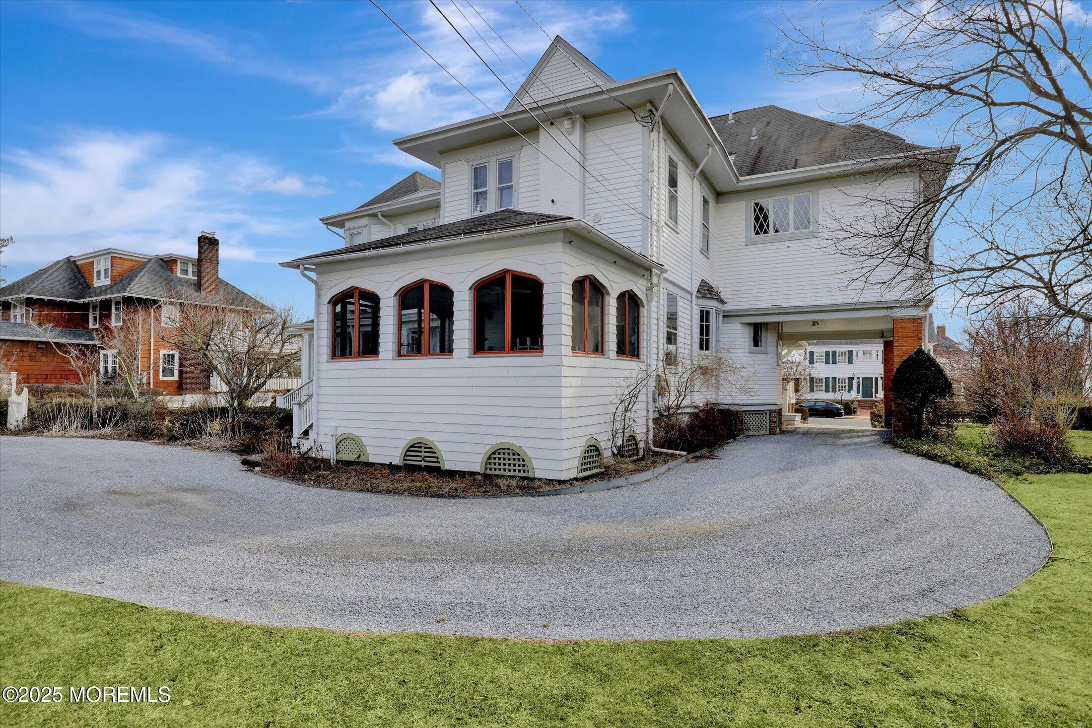 211 Cedar Avenue Allenhurst, NJ 07711 - Photo 47 of 69 a front view of a house with a yard