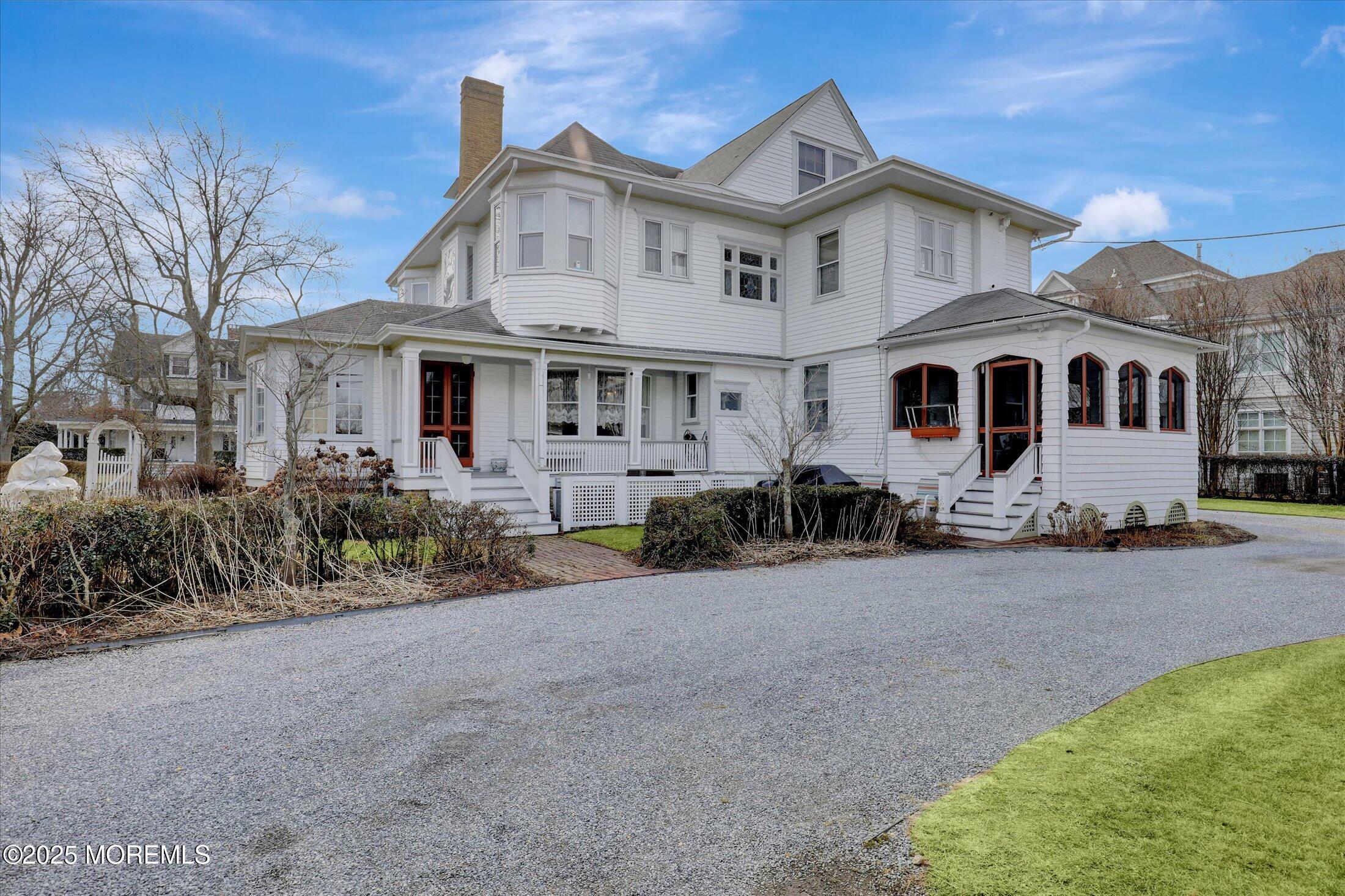 211 Cedar Avenue Allenhurst, NJ 07711 - Photo 53 of 69 a front view of a house with a yard