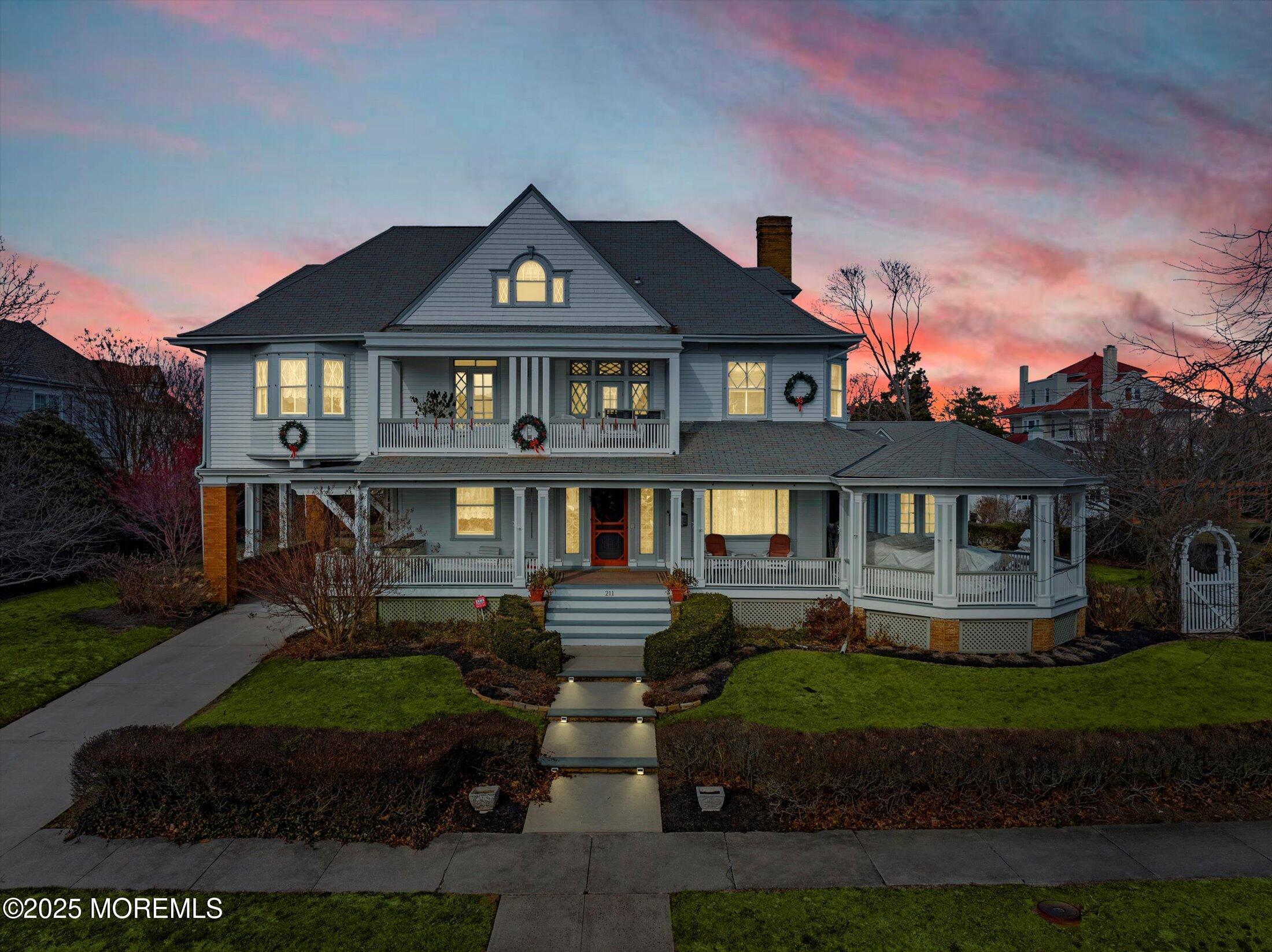 211 Cedar Avenue Allenhurst, NJ 07711 - Photo 54 of 69 a front view of a house with garden