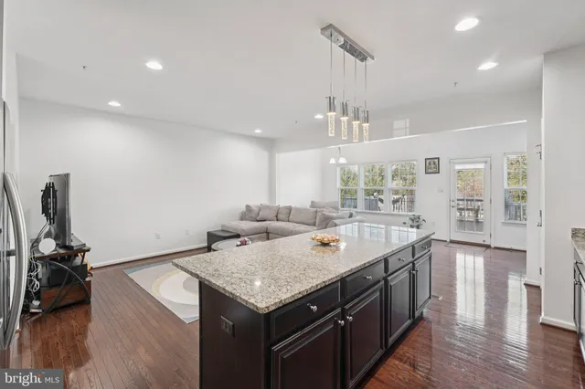 a kitchen with a stove a sink and a refrigerator