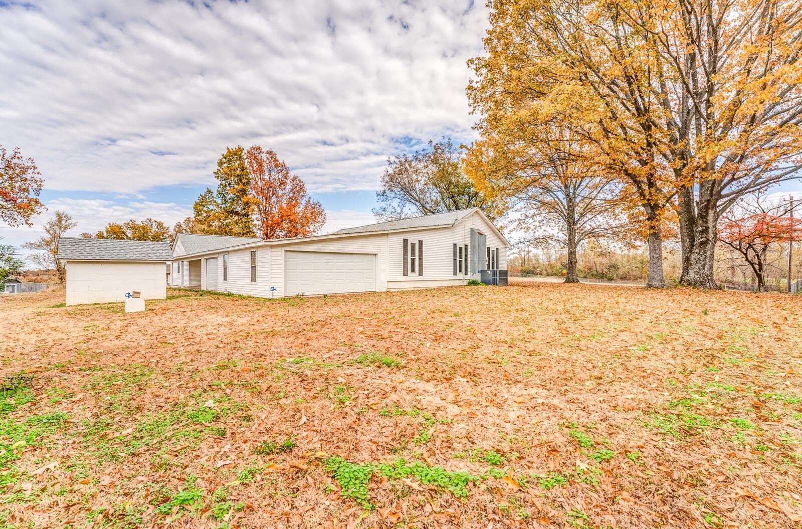 1183 Old Memphis Road Covington, TN 38019 - Photo 26 of 29 View of front of house with a garage