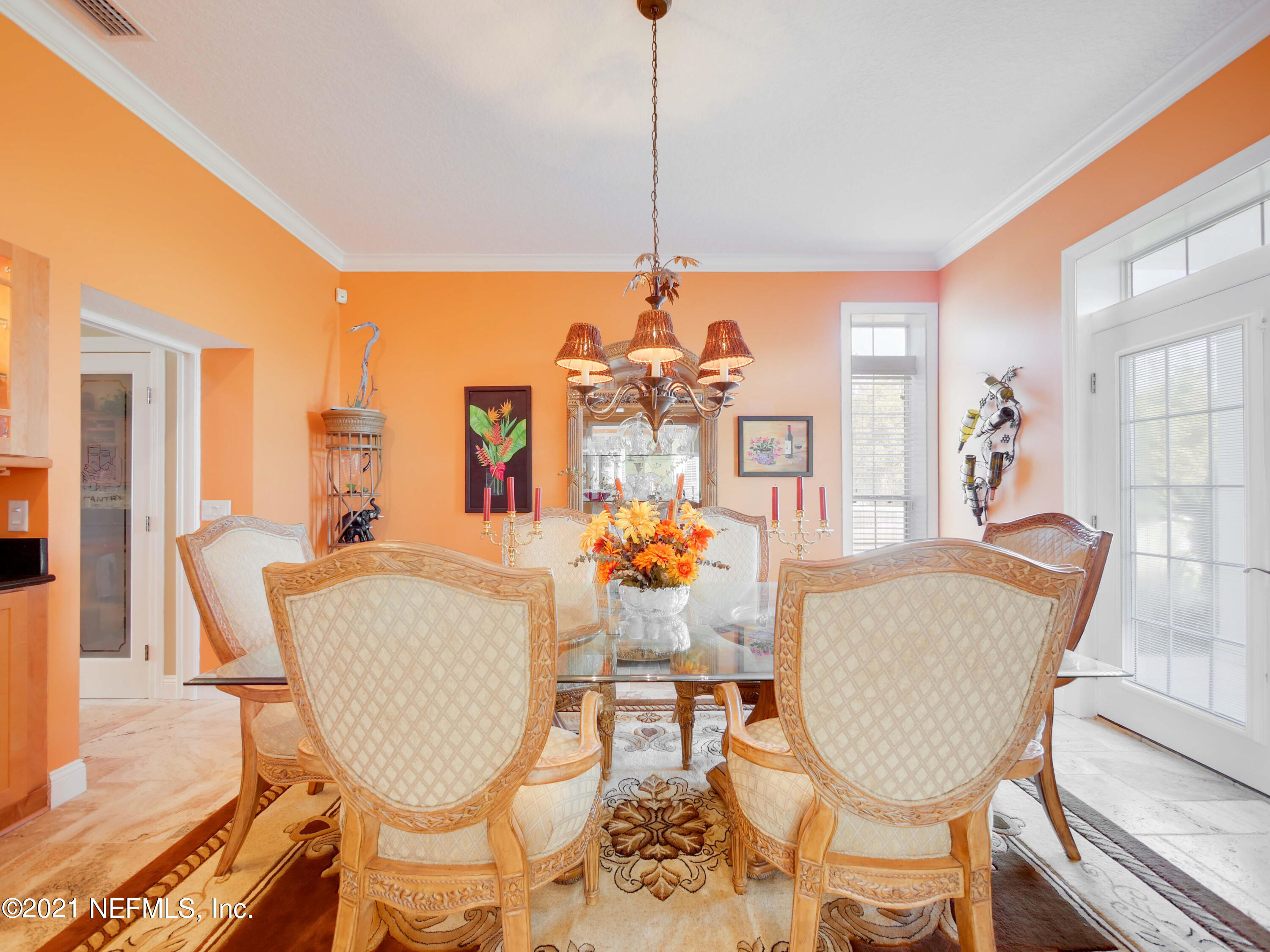 8115 A1A South St. Augustine, FL 32080 - Photo 12 of 50 a view of a dining room with furniture window and wooden floor