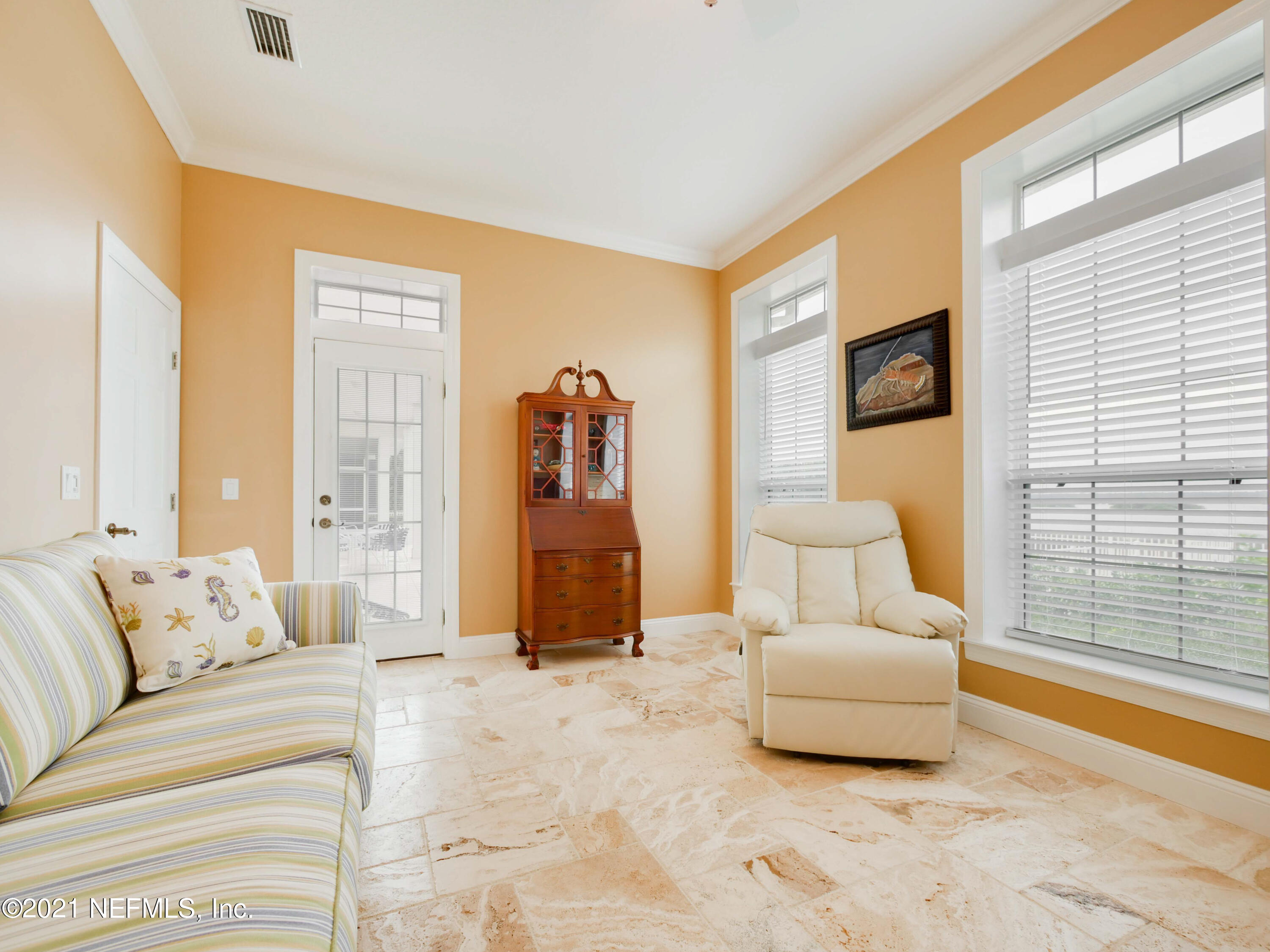 8115 A1A South St. Augustine, FL 32080 - Photo 21 of 50 a living room with furniture and a large window