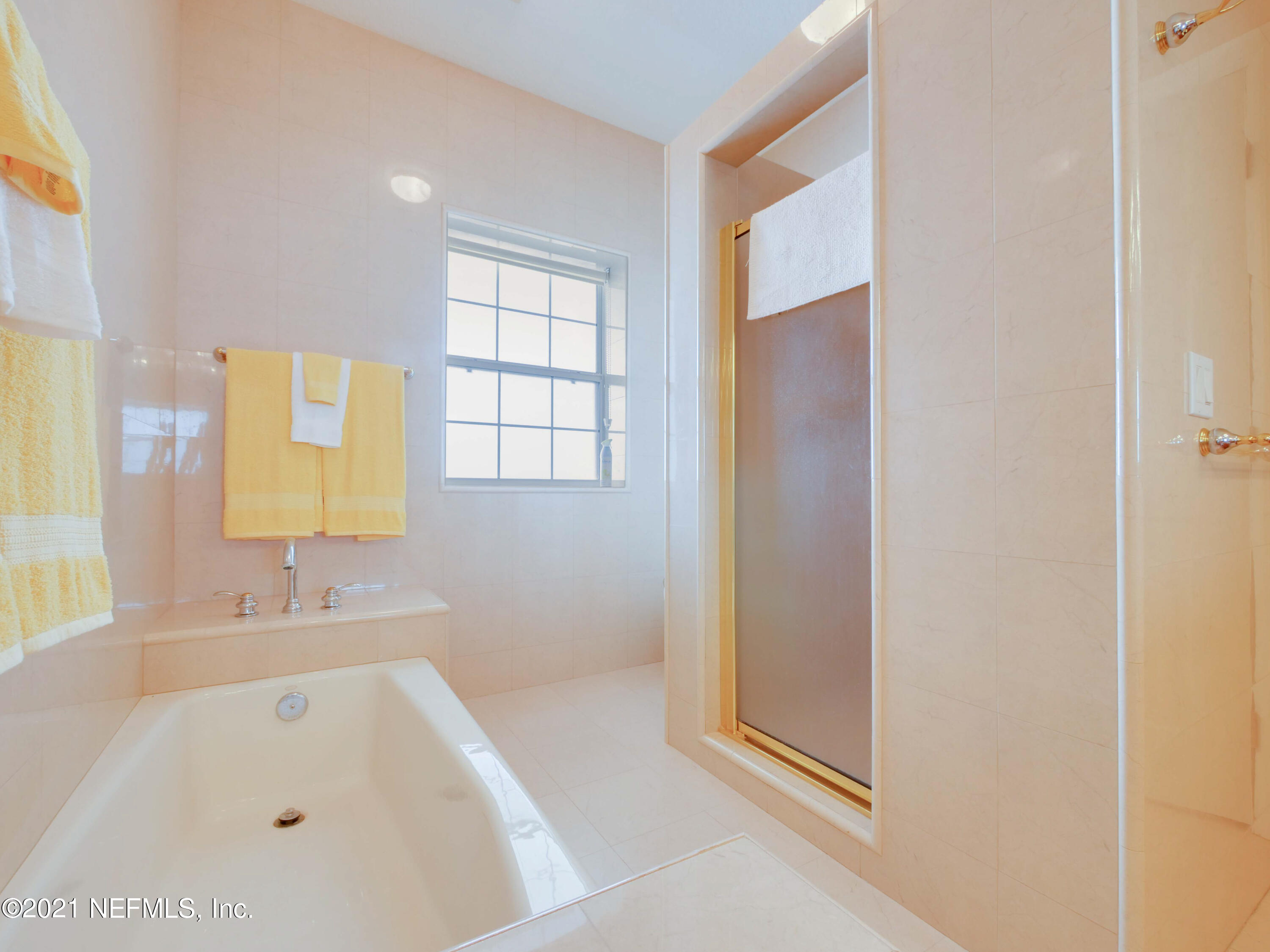 8115 A1A South St. Augustine, FL 32080 - Photo 38 of 50 a bathroom with a bathtub and a sink
