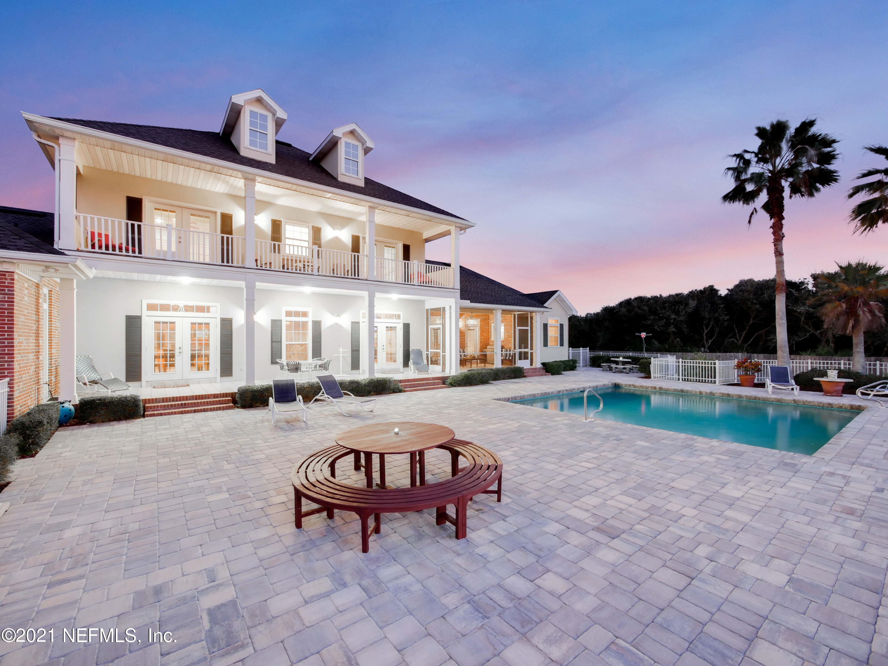 8115 A1A South St. Augustine, FL 32080 - Photo 45 of 50 a swimming pool with outdoor seating and yard