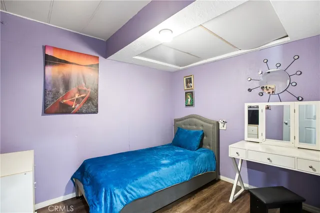 a bedroom with a bed and a table in it