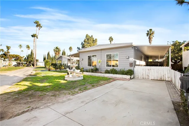 a view of a house with entertaining space and a yard