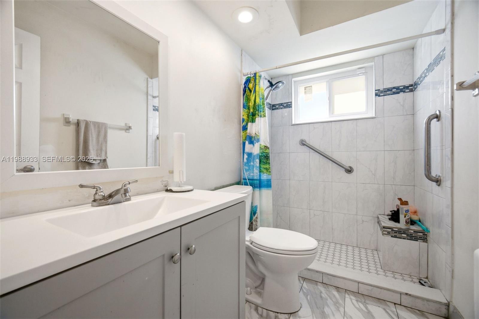 841 Southwest 55th Avenue Margate, FL 33068 - Photo 17 of 26 a bathroom with a sink toilet and shower