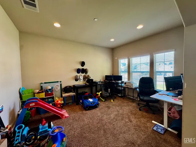 a view of a workspace with furniture