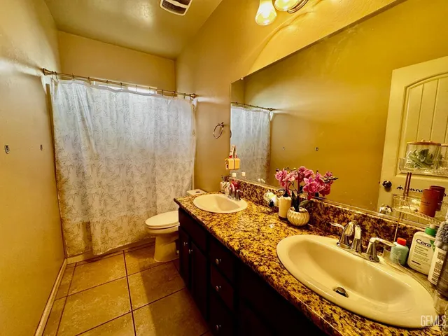 a bedroom with bed and window