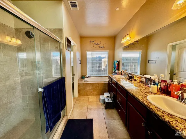 a view of swimming pool with outdoor seating and plants