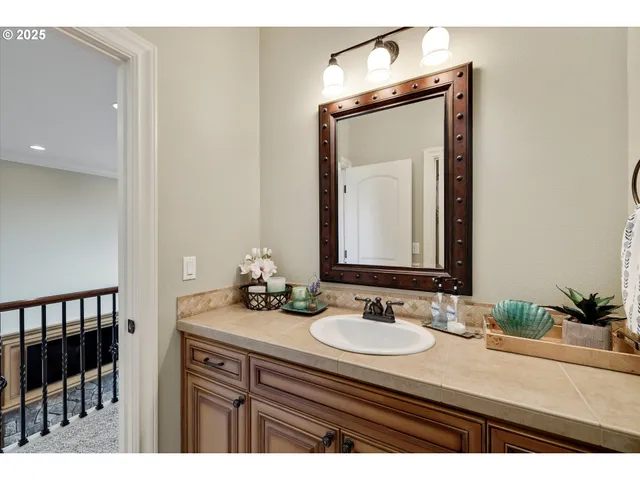a bathroom with a sink vanity and a mirror