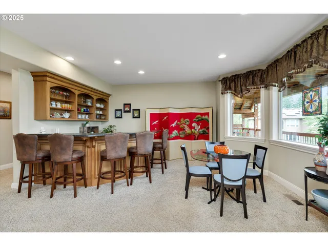 a view of a dining room with furniture and window