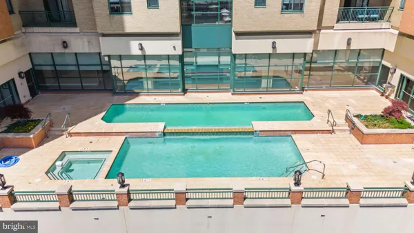 an aerial view of a tennis ground with large trees