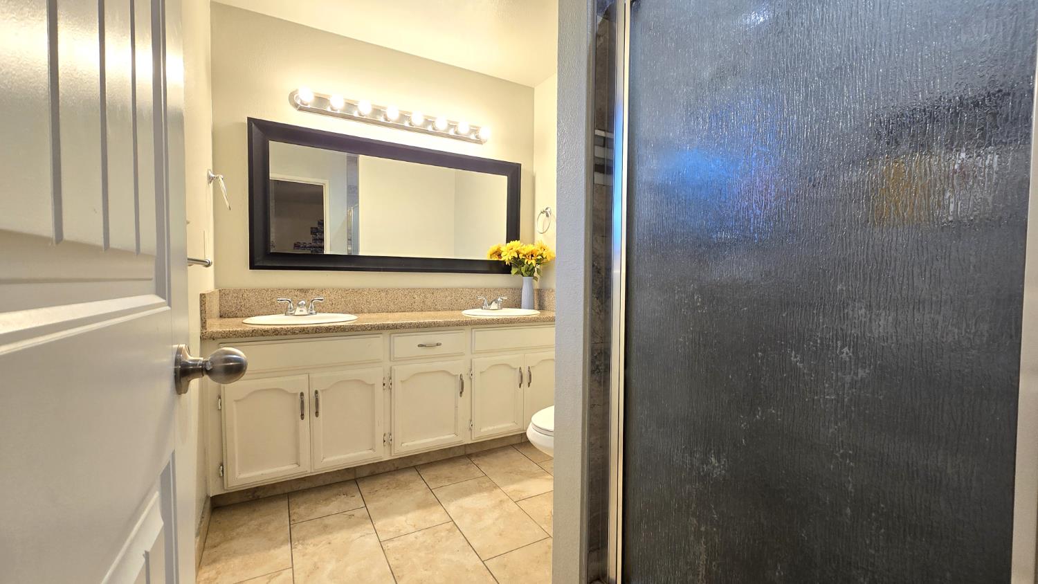 155 North Haney Avenue Reedley, CA 93654 - Photo 22 of 27 Master Restroom With 2 Sinks