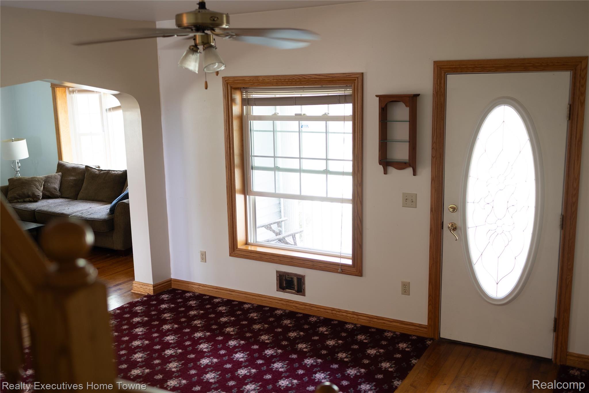 2715 Cash Road Applegate, MI 48401 - Photo 36 of 59 Entryway featuring an oval glass insert door with brass hardware, wood-trim window, and a ceiling fan