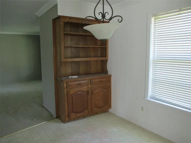 a view of storage and utility room with closet