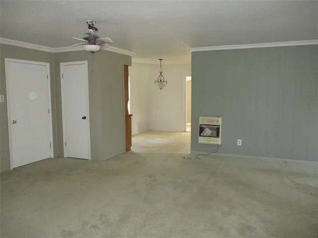 a kitchen with granite countertop a sink stove and refrigerator