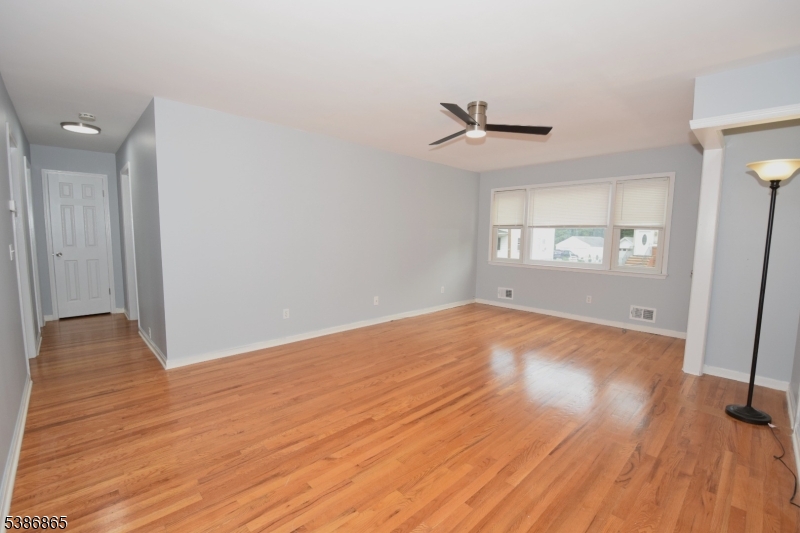 40 Glaser Avenue Raritan, NJ 08869 - Photo 16 of 28 wooden floor in an empty room with a window