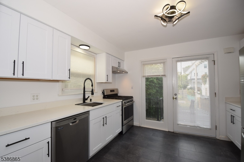40 Glaser Avenue Raritan, NJ 08869 - Photo 2 of 28 a kitchen with a sink and cabinets