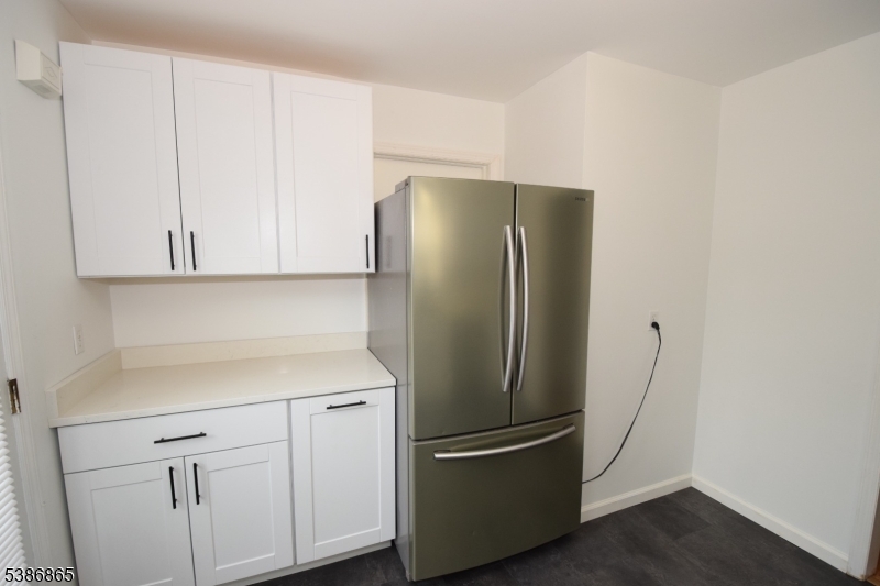 40 Glaser Avenue Raritan, NJ 08869 - Photo 7 of 28 a white refrigerator freezer sitting inside of a kitchen