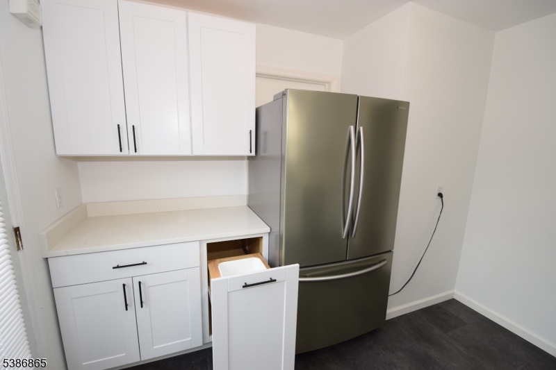 40 Glaser Avenue Raritan, NJ 08869 - Photo 8 of 28 a kitchen with metallic refrigerator freezer and a dishwasher