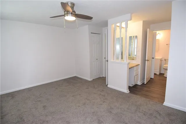 an empty room that has a window in it