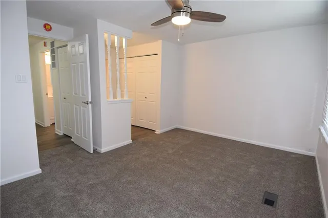 a view of hallway with wooden floor