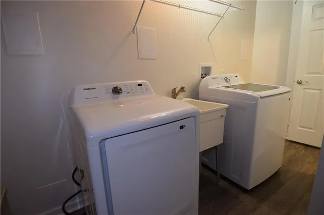 a view of a backyard with wooden fence