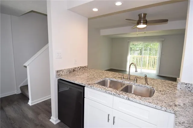 a kitchen with a sink and a window