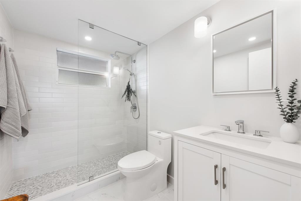 215 North Birch Road, Unit 1C Fort Lauderdale, FL 33304 - Photo 11 of 21 a bathroom with a sink toilet and shower