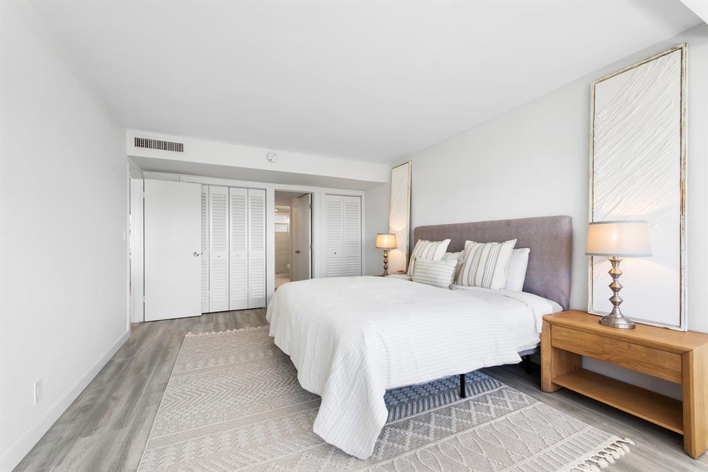 215 North Birch Road, Unit 1C Fort Lauderdale, FL 33304 - Photo 15 of 21 a bedroom with a bed and a night stand