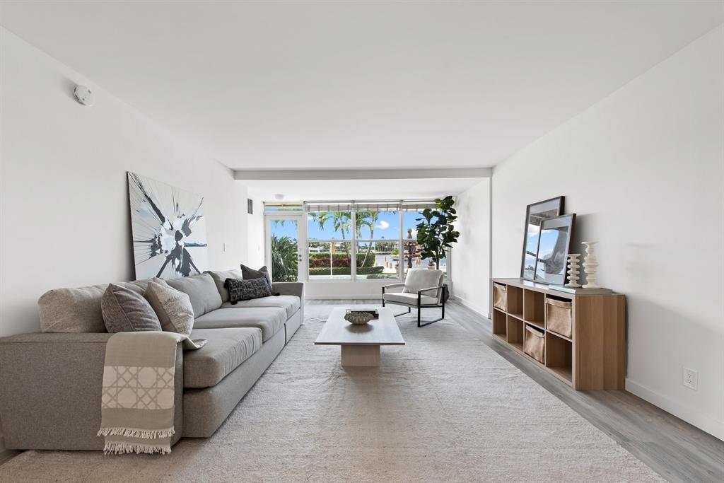 215 North Birch Road, Unit 1C Fort Lauderdale, FL 33304 - Photo 5 of 21 a living room with furniture and a flat screen tv