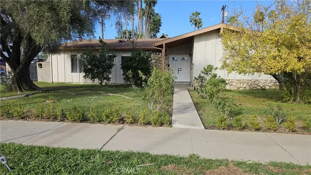a front view of house with garden
