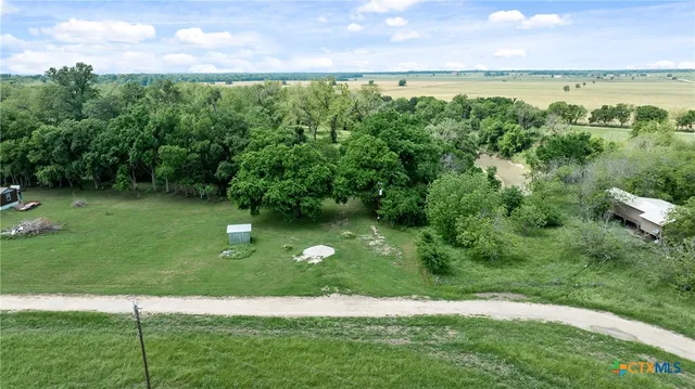 a view of a garden with a yard
