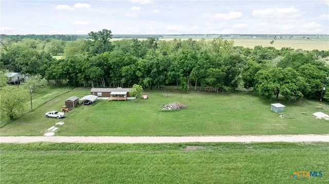 a view of a golf course with a lake