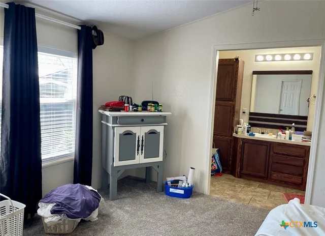 a room with furniture and cabinets