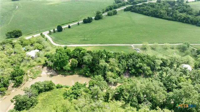 a view of a green field with clear sky