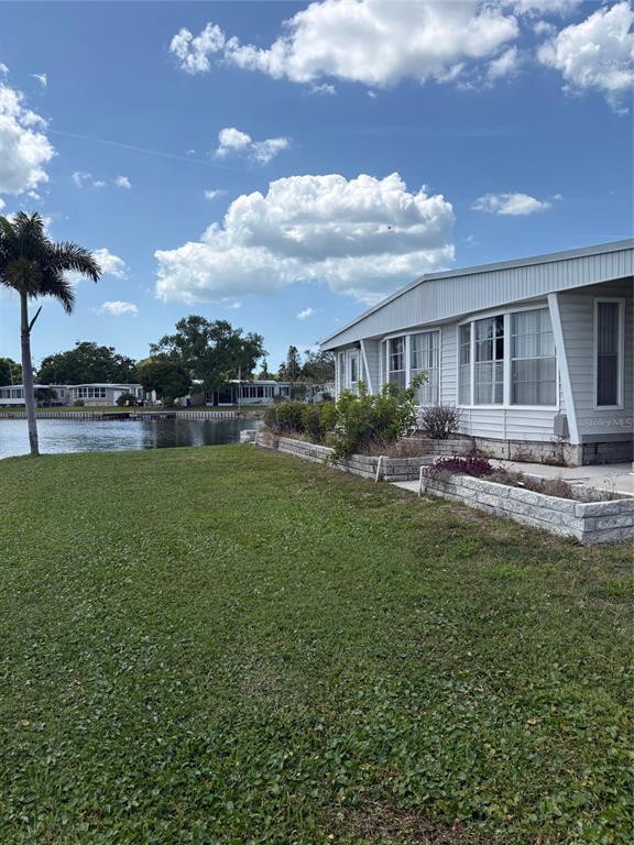 10057 110th Place, Unit 243 Largo, FL 33773 - Photo 12 of 32 a front view of a house with garden