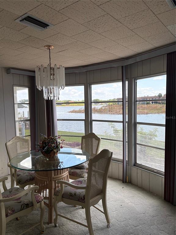 10057 110th Place, Unit 243 Largo, FL 33773 - Photo 15 of 32 a view of a dining room with furniture and window