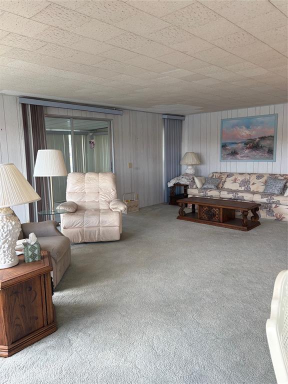 10057 110th Place, Unit 243 Largo, FL 33773 - Photo 18 of 32 a living room with furniture and a lamp