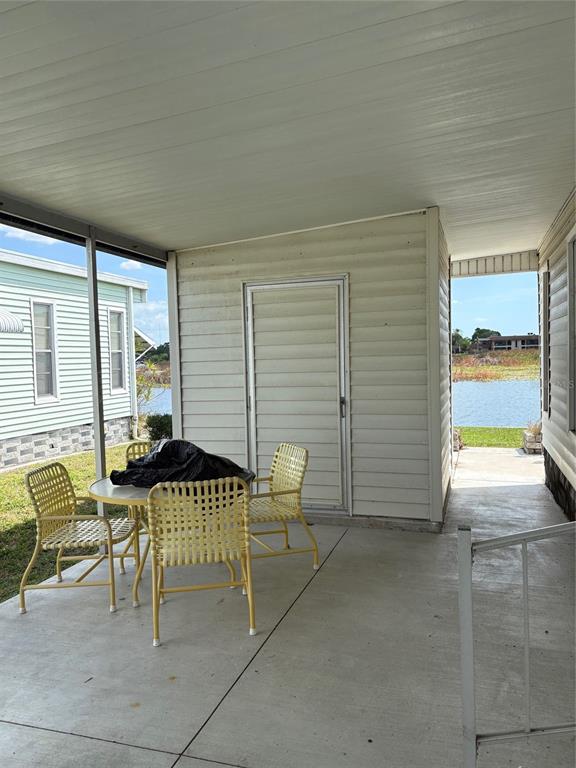 10057 110th Place, Unit 243 Largo, FL 33773 - Photo 2 of 32 a backyard of a house with outdoor seating