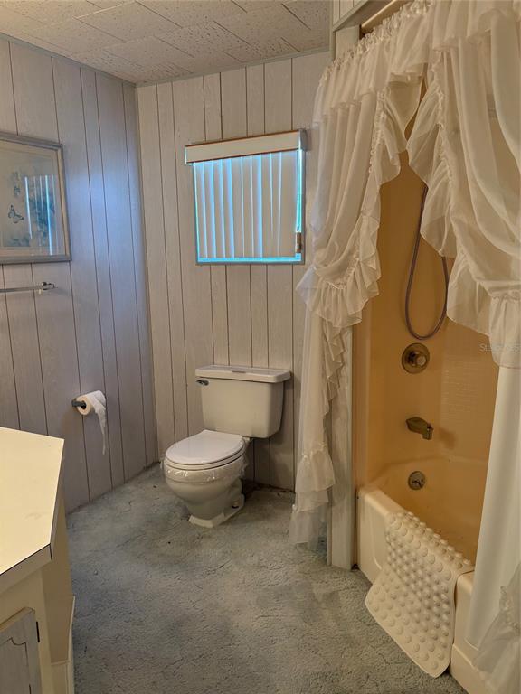 10057 110th Place, Unit 243 Largo, FL 33773 - Photo 21 of 32 a bathroom with a toilet and shower