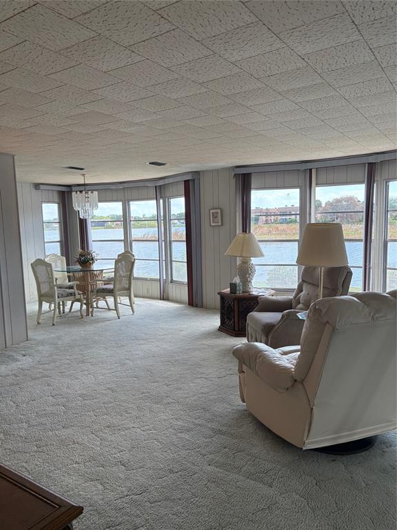 10057 110th Place, Unit 243 Largo, FL 33773 - Photo 28 of 32 a living room with furniture and a large window